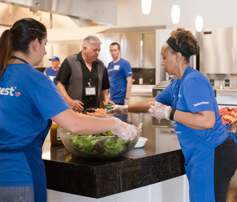 A volunteer group preparing a meal at Ronald McDonald House Dallas
